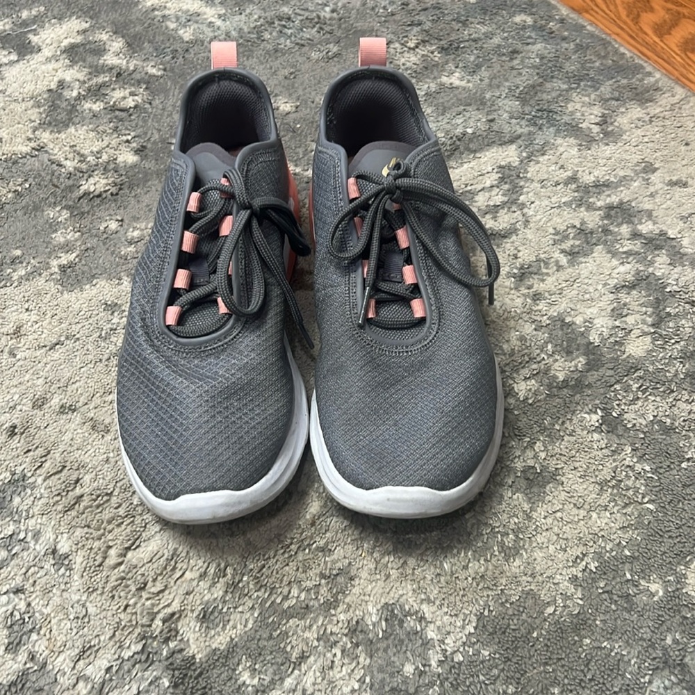 Women’s pink, gray, and white size 8.5 Nike sneakers